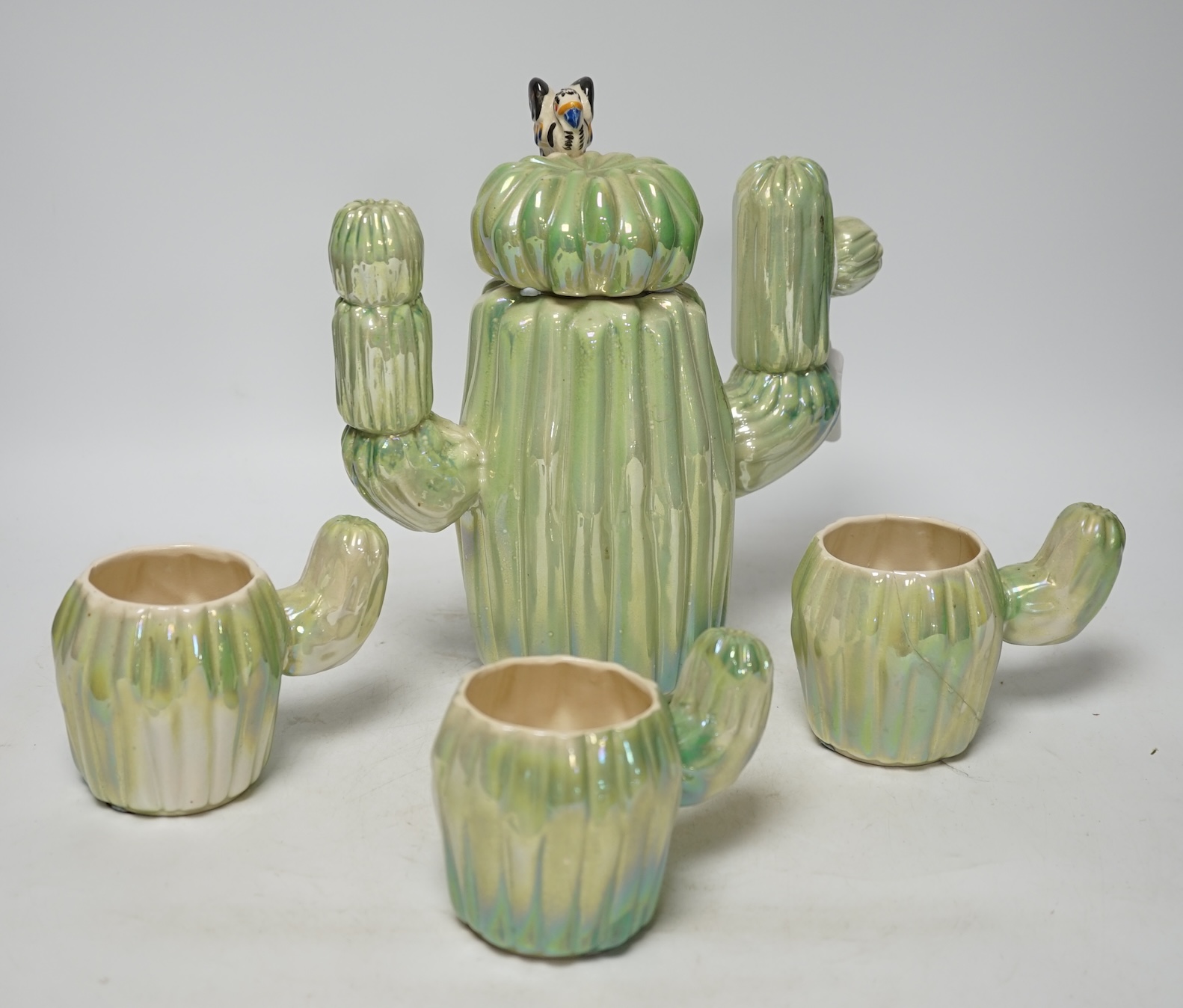 From the Studio of Fred Cuming. A cactus design part coffee set, largest 24cm high. Condition - fair, one cup broken and repaired